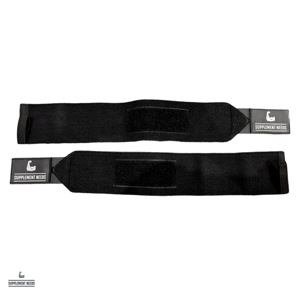 A pair of black wrist wraps with a label showing the brand name 'Supplement Needs'.