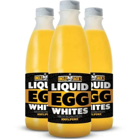 Three bottles of Uncle Jack's Liquid Egg Whites, with yellow liquid visible inside the bottles. Each bottle has a label indicating '100% Pure' and 'Liquid Egg Whites'.