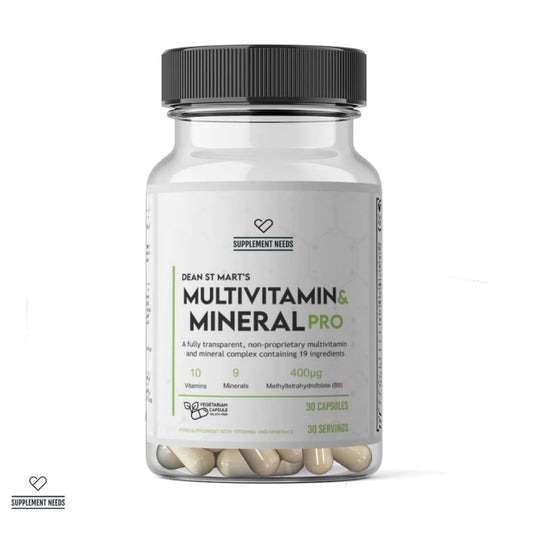 A clear supplement bottle with a black ribbed cap and a white label reading 'DEAN ST MART'S MULTIVITAMIN & MINERAL PRO' by Supplement Needs, containing beige capsules visible through the bottom, on a white background.